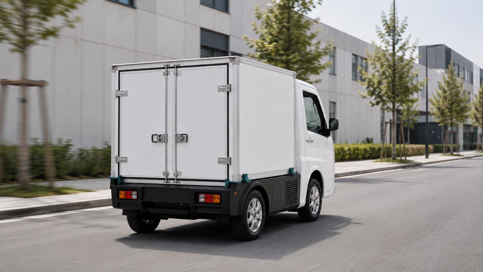 White BeeMotors Buzzy Picko driving away with its detachable cargo pod secured